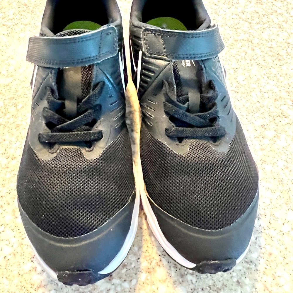 Nike Kid’s shoes size 3.   Not toddler, kid size